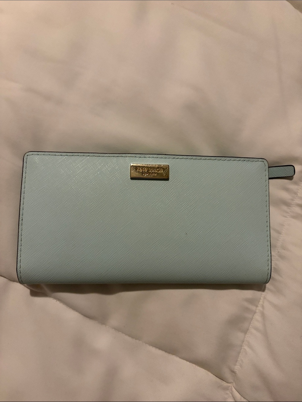 kate spade pale blue zip-around wallet with gold plaque
